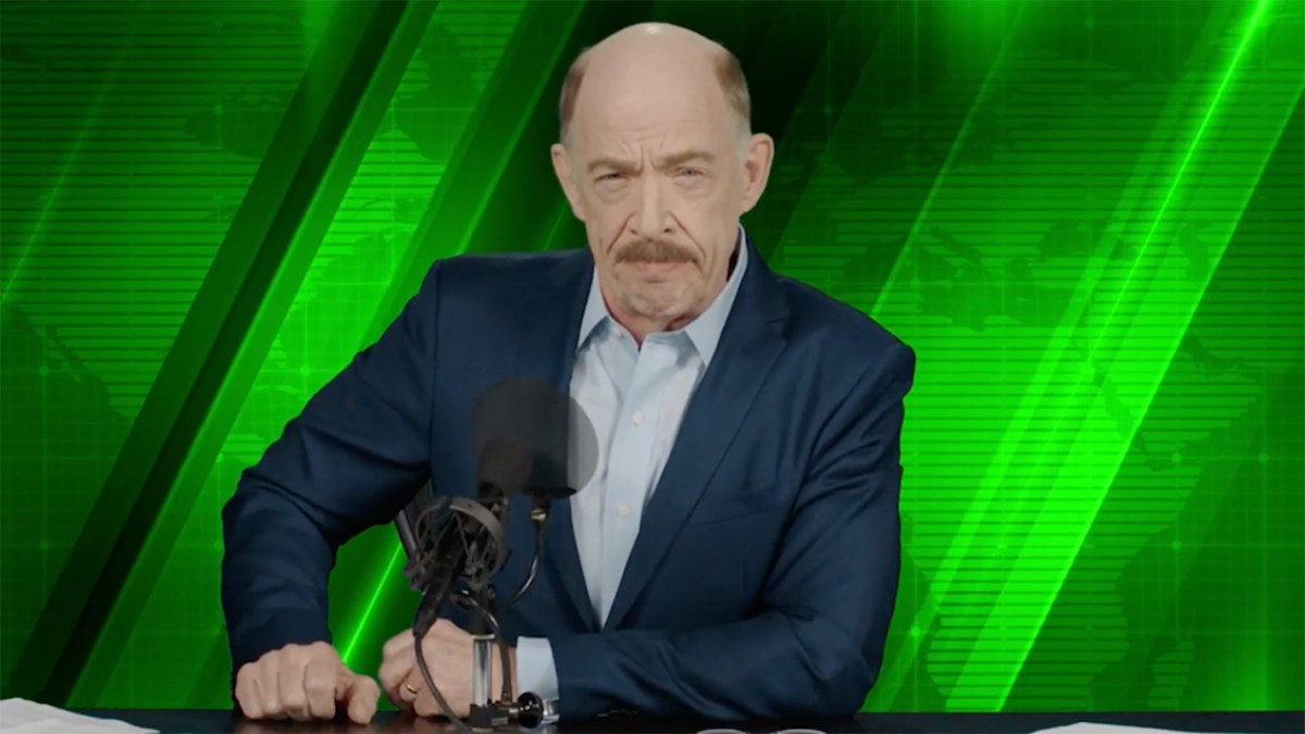 J.K Simmons at a table as J. Jonah Jameson in Spider-Man: Far From Home