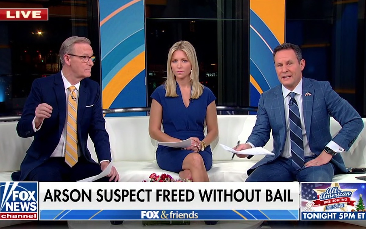The hosts of Fox & Friends talk above a chyron reading "Arson suspect freed without bail"