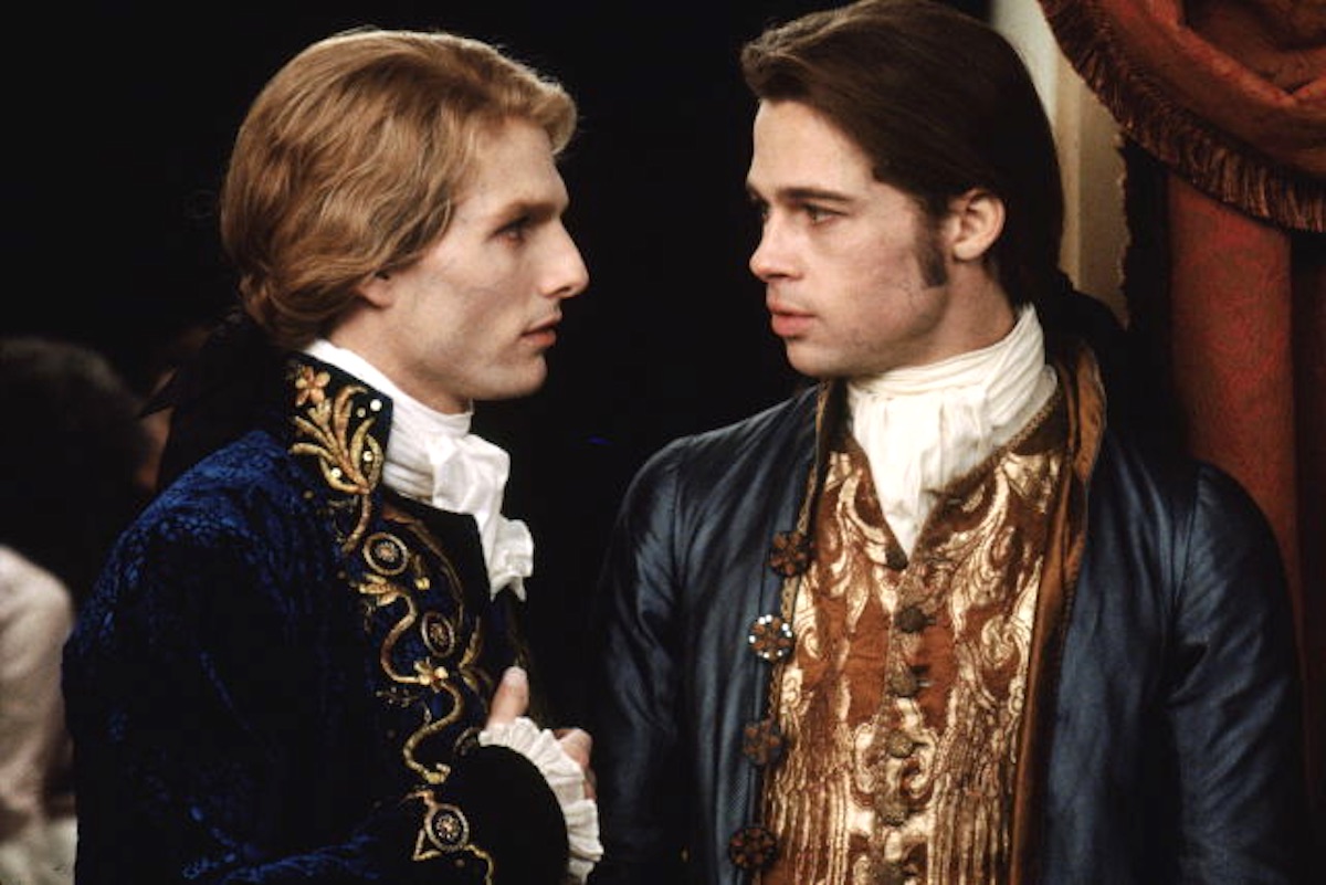 Tom Cruise as Lestat stands next to Brad Pitt as Louis in 'Interview With the Vampire'