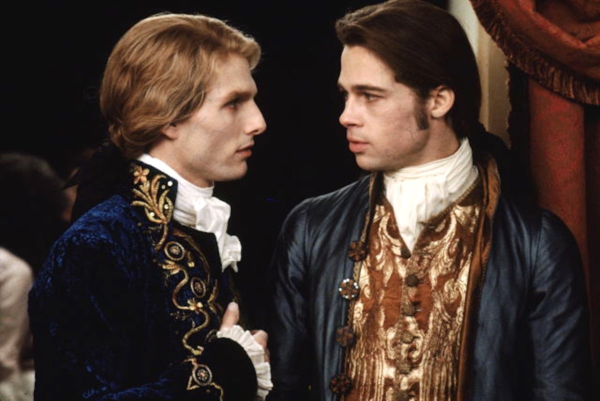 Tom Cruise as Lestat stands next to Brad Pitt as Louis in 'Interview With the Vampire'