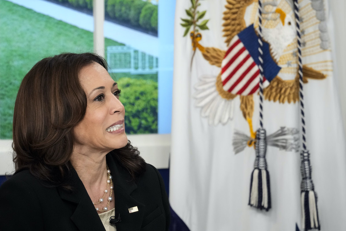 Kamala Harris sits in front of a window in the White House and appears to cringe.