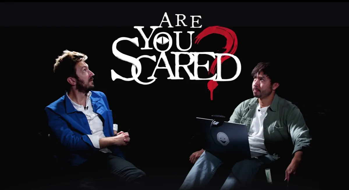 Ryan Bergara and Shane Madej staring at the "Are You Scared" sign