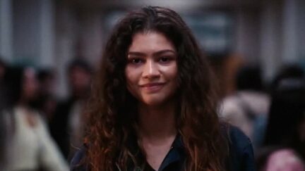 Zendaya staring into the camera as Rue