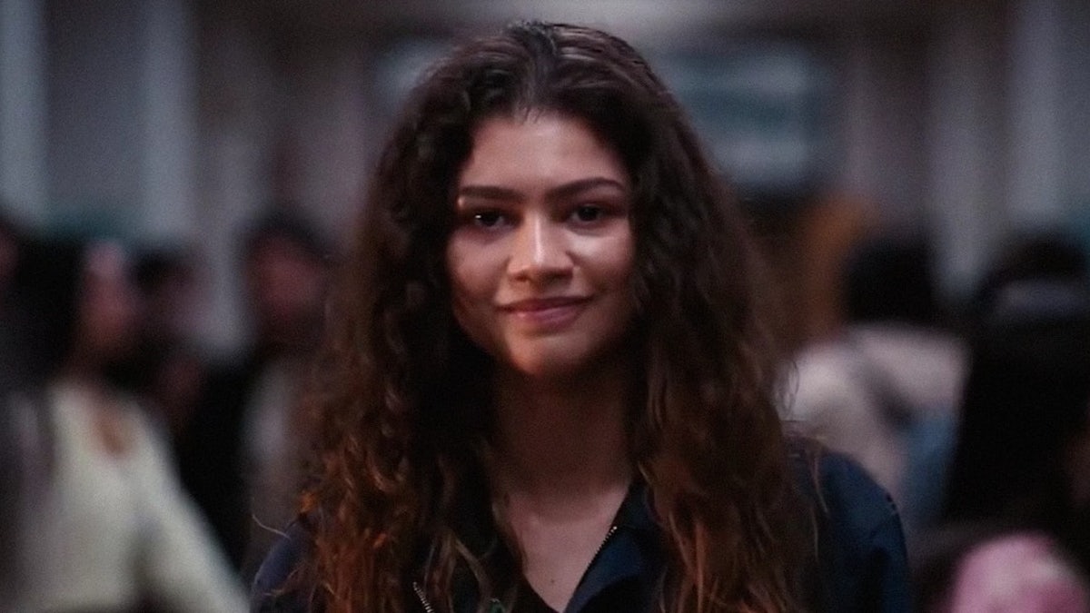 Zendaya staring into the camera as Rue