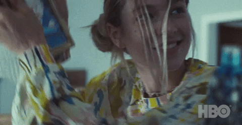 hunter schafer as jules holding up pictures in euphoria