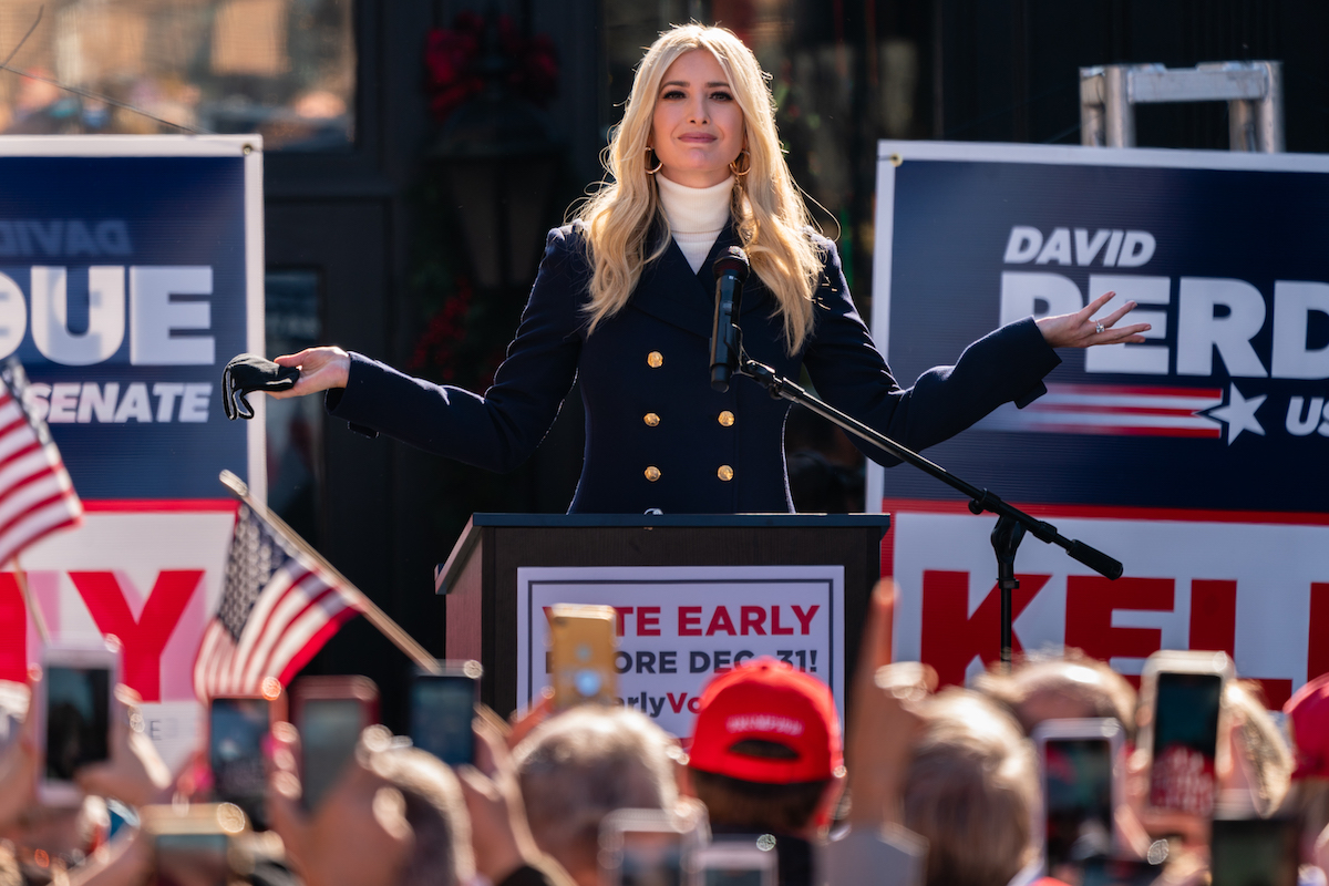 Ivanka Trump holds her arms out in a wide shrug during a campaign rally for David Perdue.