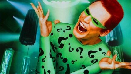 Jim Carey laughs as The Riddler in key art from Batman Forever