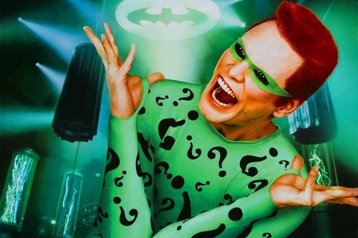Jim Carey laughs as The Riddler in key art from Batman Forever