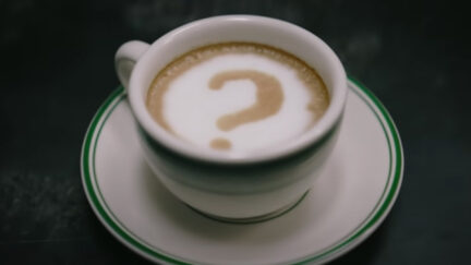 The Riddler's coffee mug on a table in the Batman