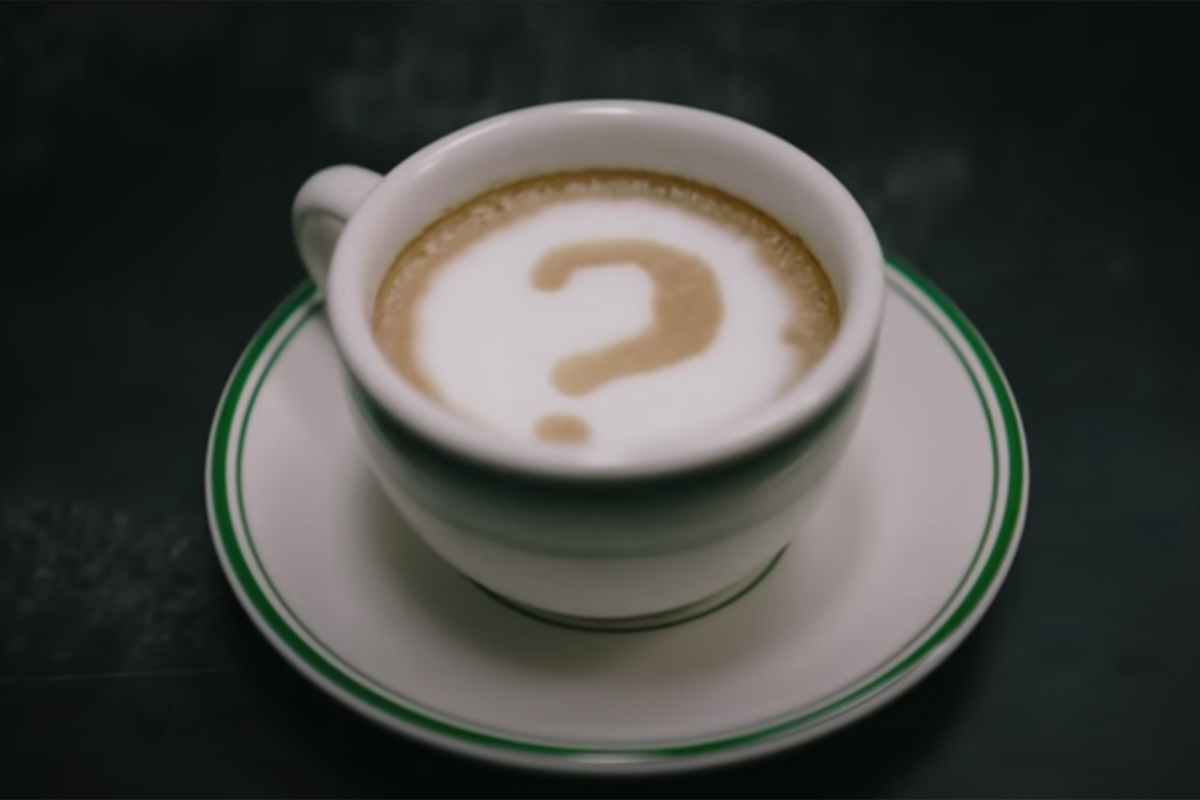 The Riddler's coffee mug on a table in the Batman