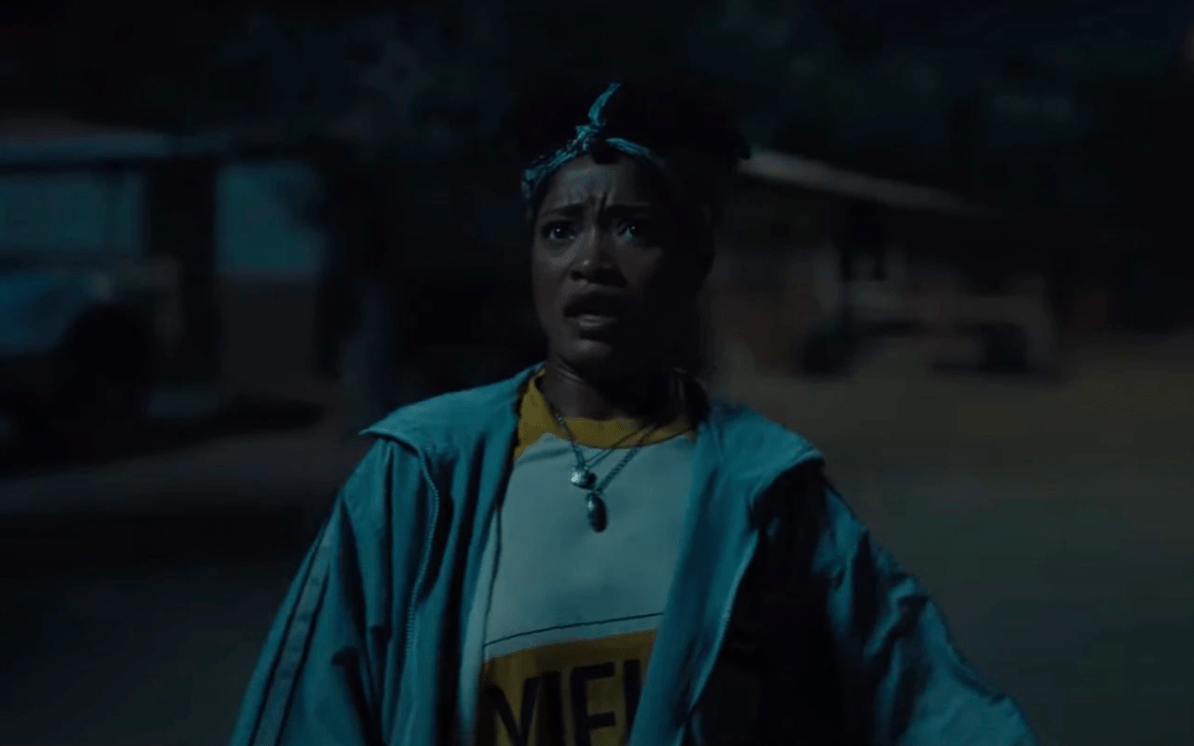 Keke Palmer looking afraid of what's coming from the sky in Jordan Peele's NOPE