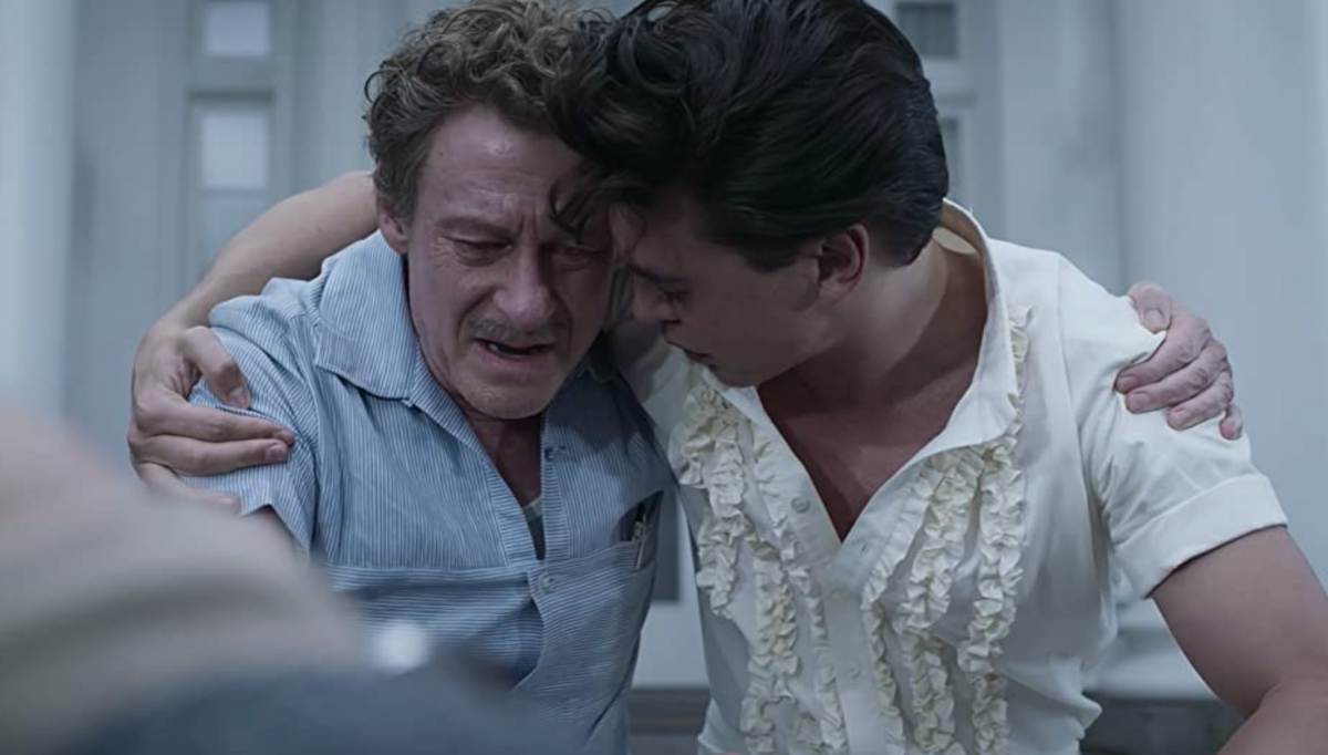 Vernon Presley distraught, being comforted by his son Elvis