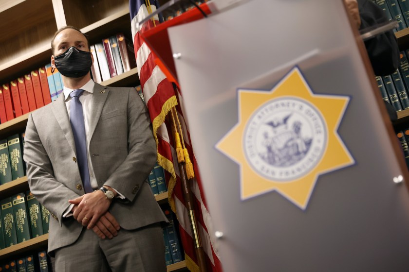 San Francisco District Attorney Chesa Boudin looks on during a press conference at his office