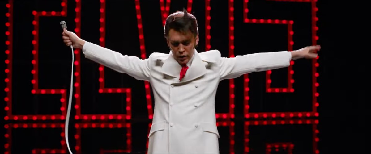 Austin Butler standing in the iconic Elvis pose from If I Can Dream in Elvis