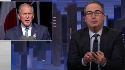 John Oliver speaks from his news desk on Last Week Tonight next to a picture of George W. Bush.