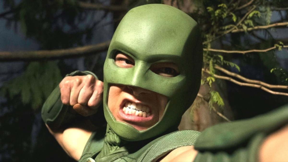 Judomaster winding up a punch at the camera in Peacemaker.