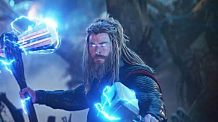 Thor holding Stormbreaker, surrounded by lightning.