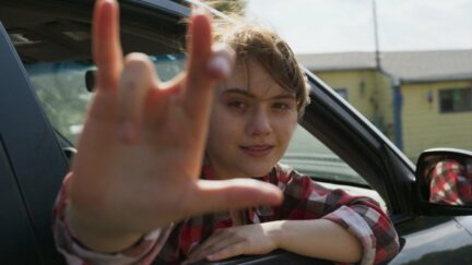 Emilia Jones hanging out a car window in CODA