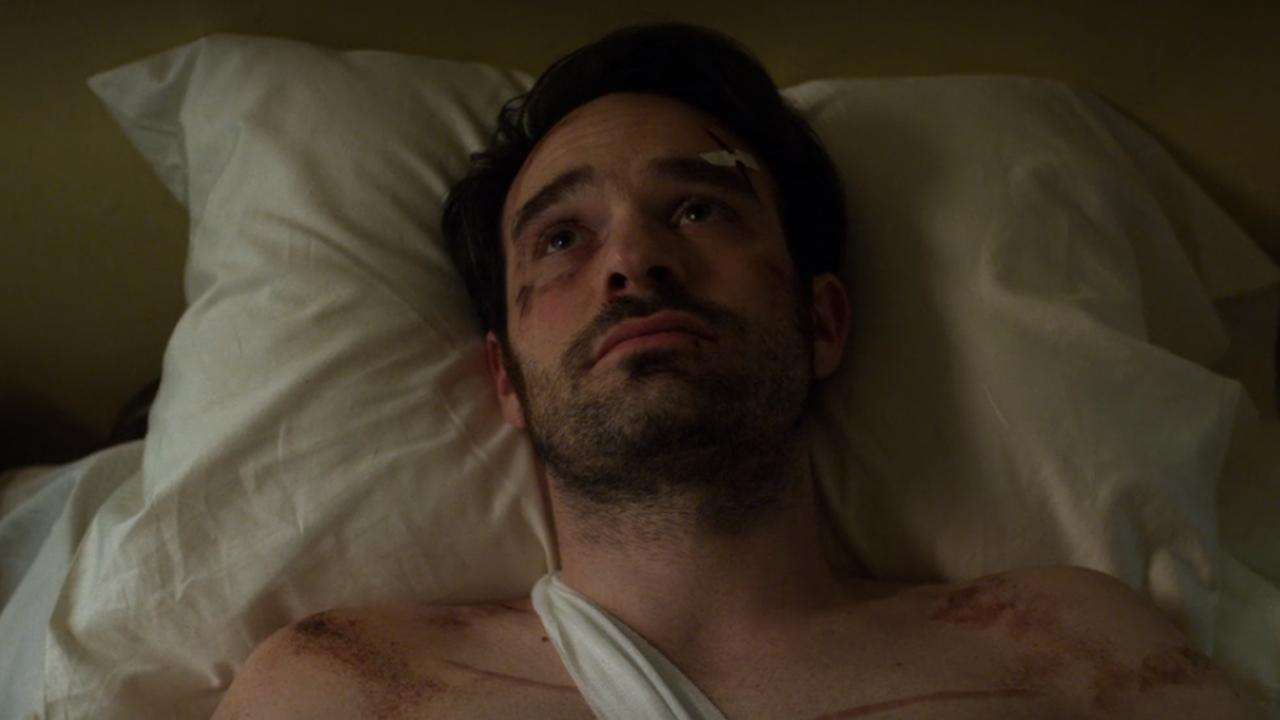 Matt Murdock lying in bed and staring at the ceiling in a scene from 'Daredevil'