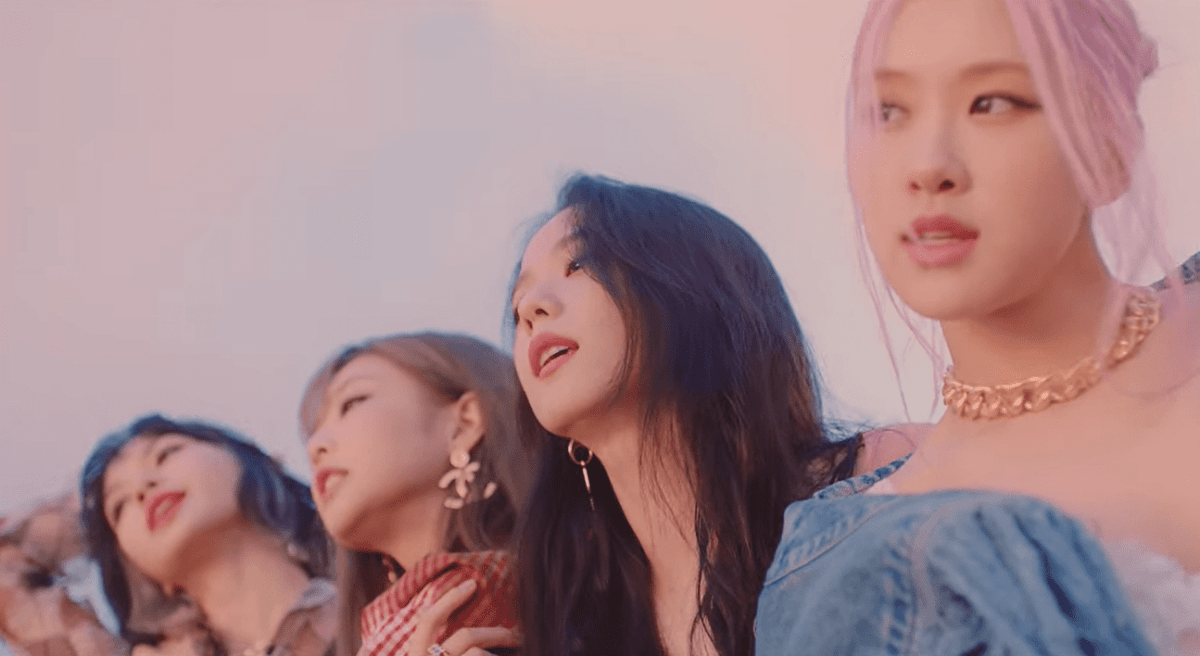 A picture of the four members of BLACKPINK (left to right: Lisa, Jennie, Jisoo, Rosé) in the MV for their single "Lovesick Girls"