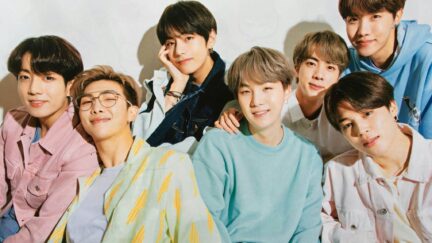 A picture of the seven members of BTS posing together.