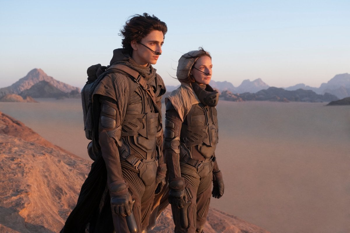Timothee Chalamet standing in the desert in the movie 'Dune'