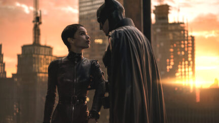 Zoë Kravitz and Robert Pattinson in The Batman strike a dramatic pose.