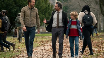 Ryan Reynolds, Mark Ruffalo, and Walker Scobell walking together in the Adam Project