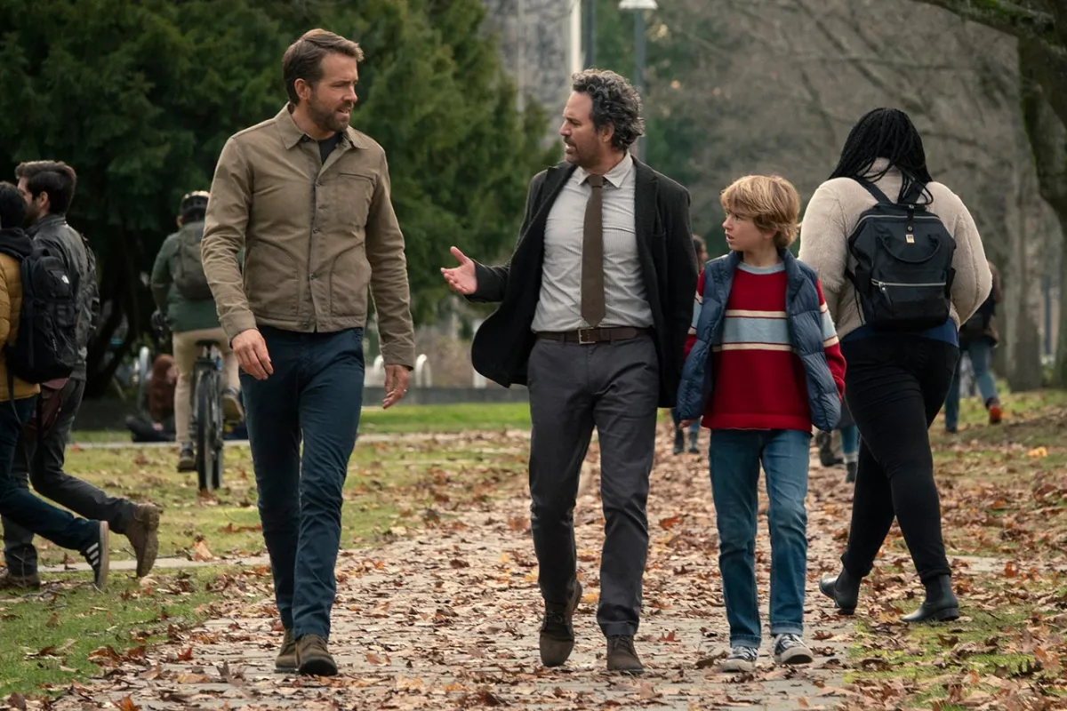 Ryan Reynolds, Mark Ruffalo, and Walker Scobell walking together in the Adam Project