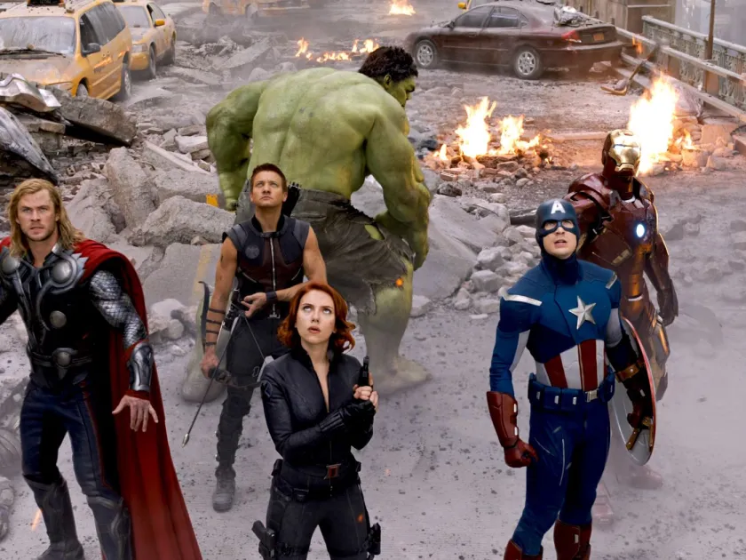The Avengers stand in rubble post-battle