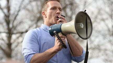 Eric Greitens speaks into a megaphone