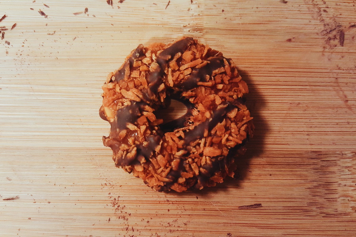 A single Samoa/Caramel DeLite Girl Scout cookie on a table