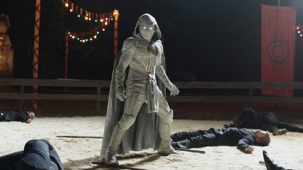 Moon Knight promo photo featuring Moon Knight standing amidst downed opponents.