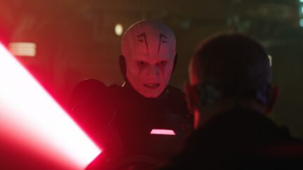 An Inquisitor wielding his double bladed red lightsaber in Obi-Wan Kenobi.