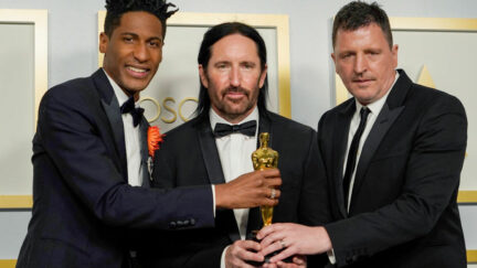 Jon Batiste and Trent Reznor and Atticus Ross, winners of the award for best original score Oscar for 