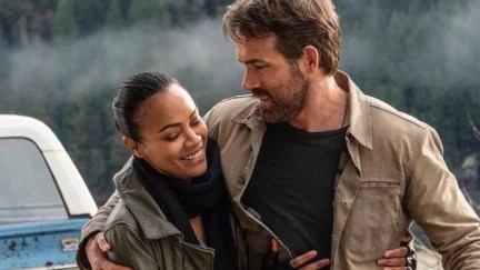 Zoe Saldaña and Reynolds in the Adam Project hugging