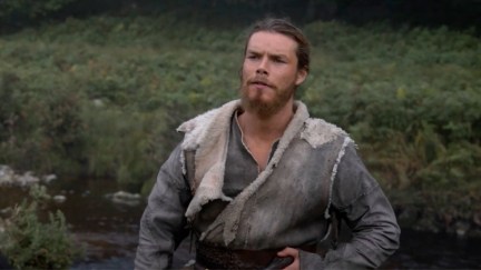 Sam Corlett as Leif Erikson, standing in a field.