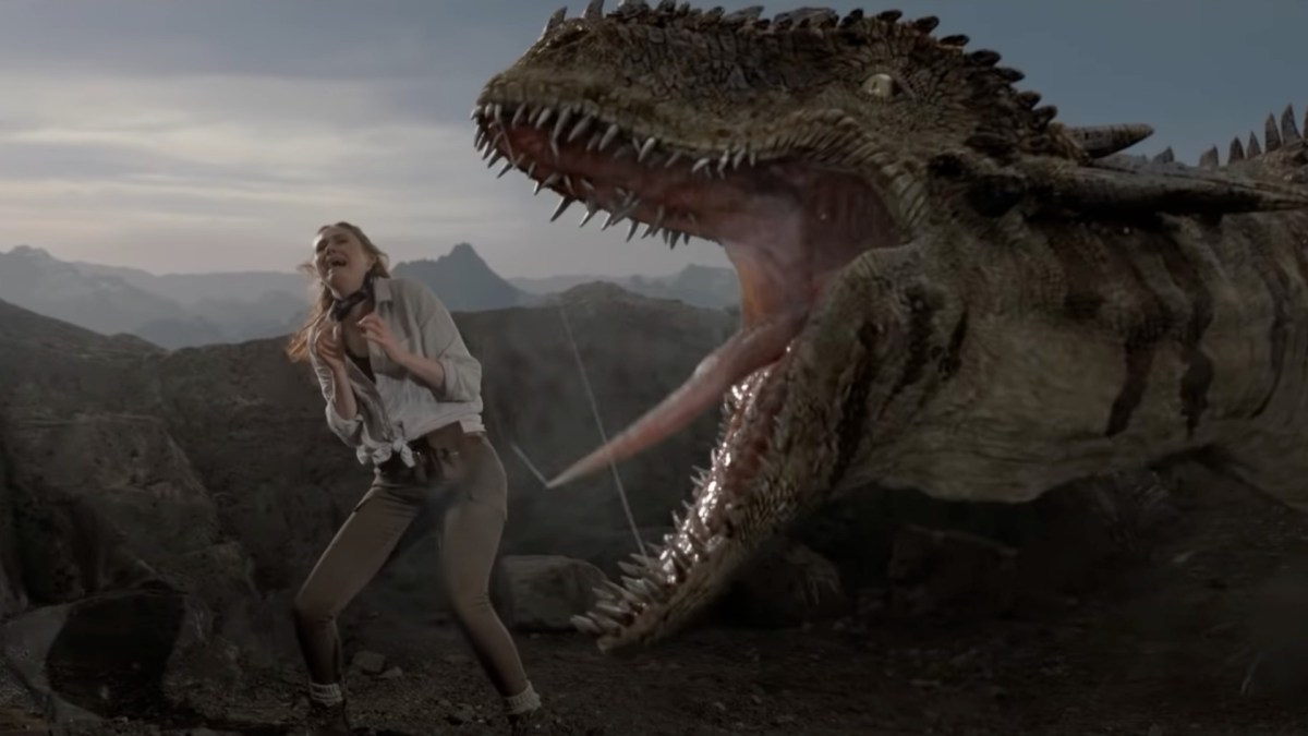 Karen Gillan screaming with a dinosaur