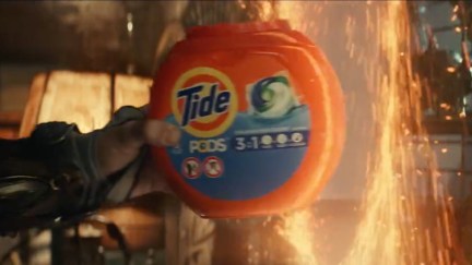 Wong pulls a bottle of Tide detergent out of a portal.