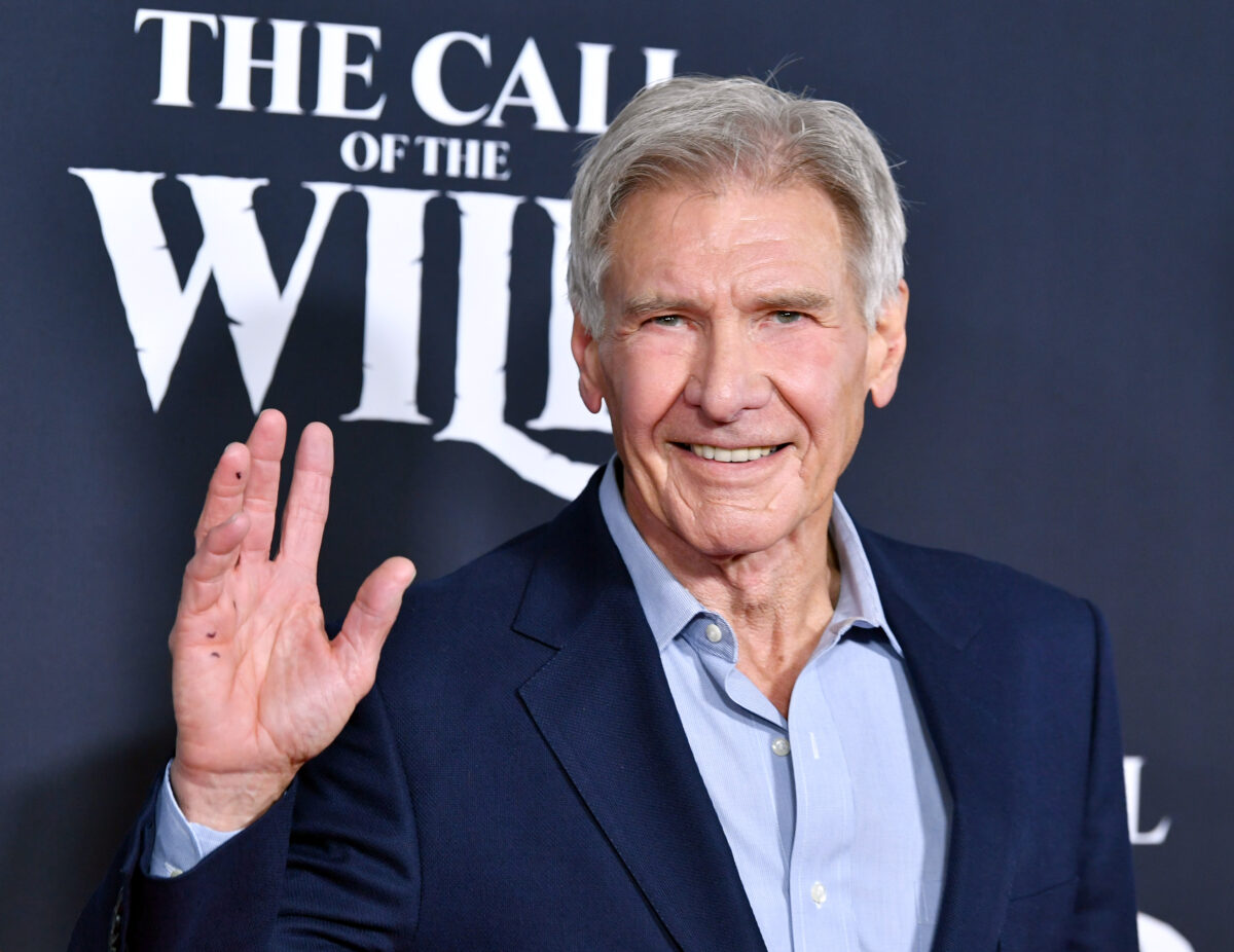 Harrison Ford waving at a premiere