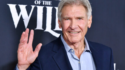 Harrison Ford waving at a premiere