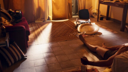 Oscar Isaac sitting shirtless on the floor in Moon Knight