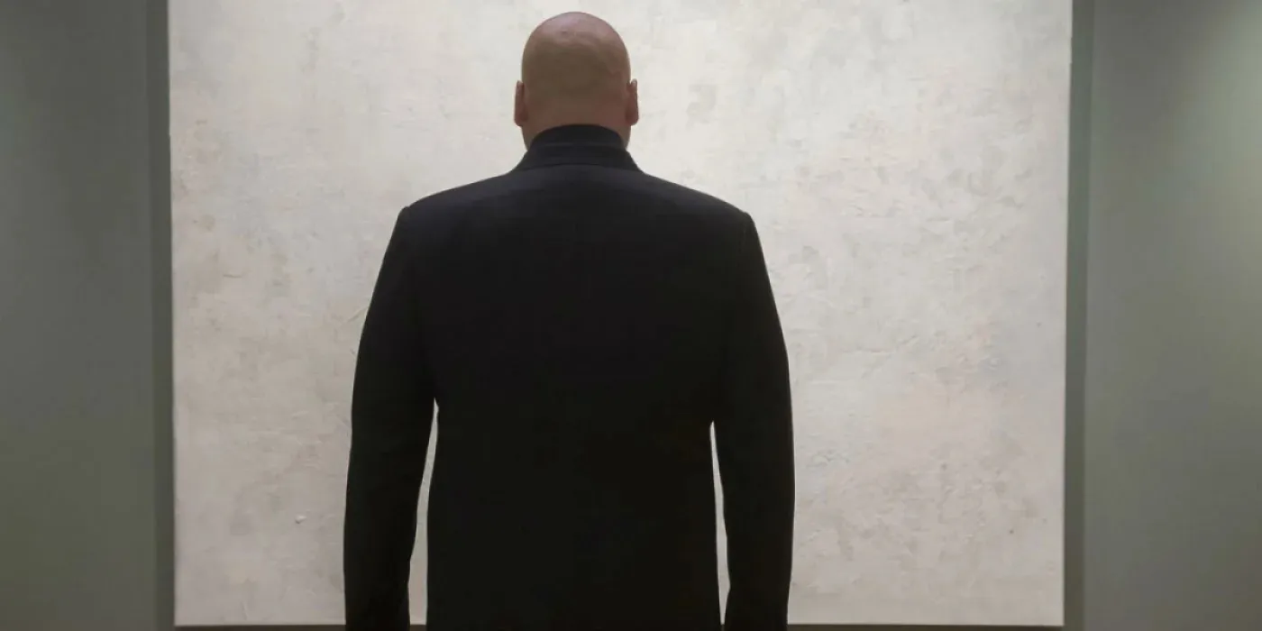 Vincent D'Onofrio as Kingpin stares at a white painting in Daredevil