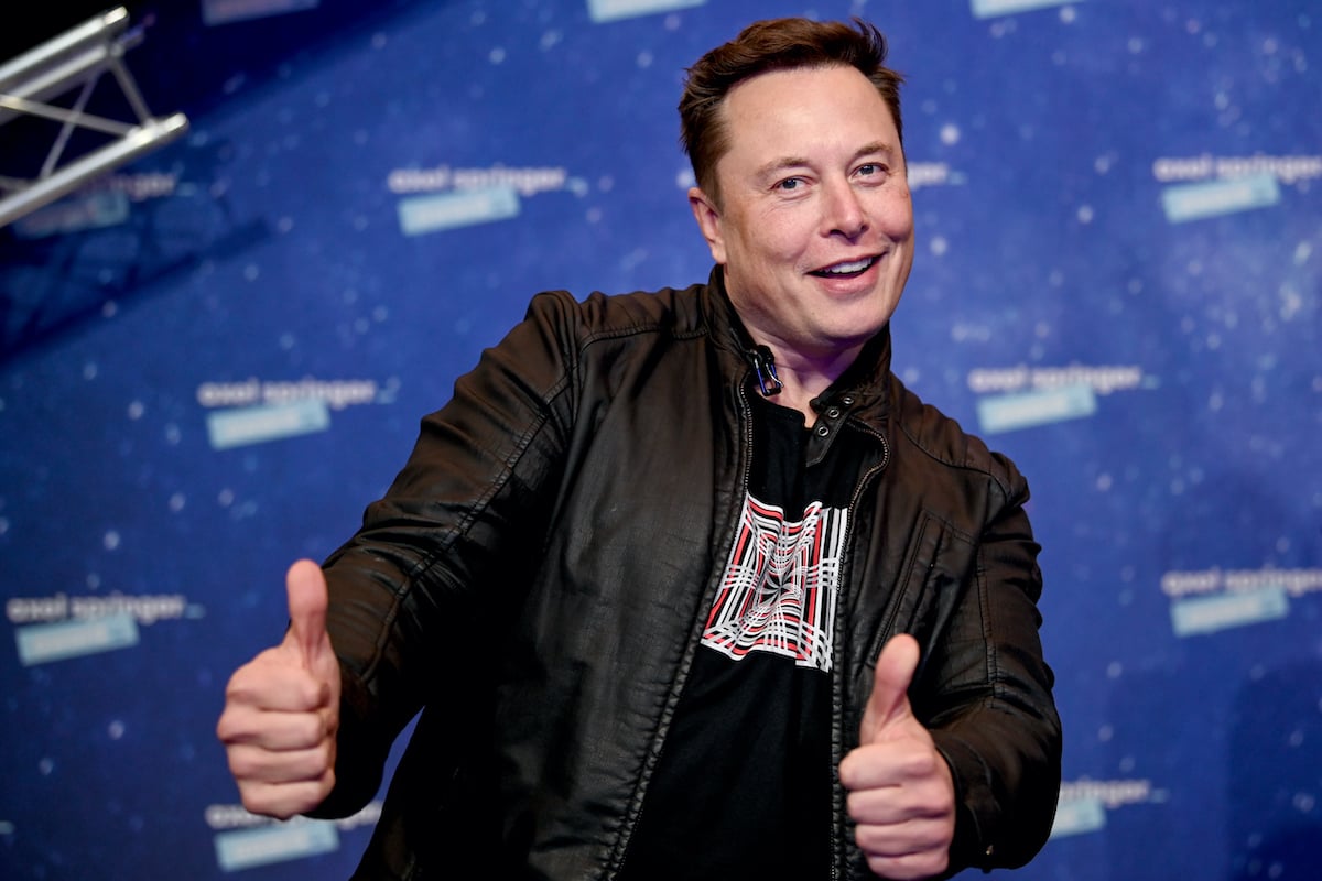 Elon Musk mugs and gives two thumbs up