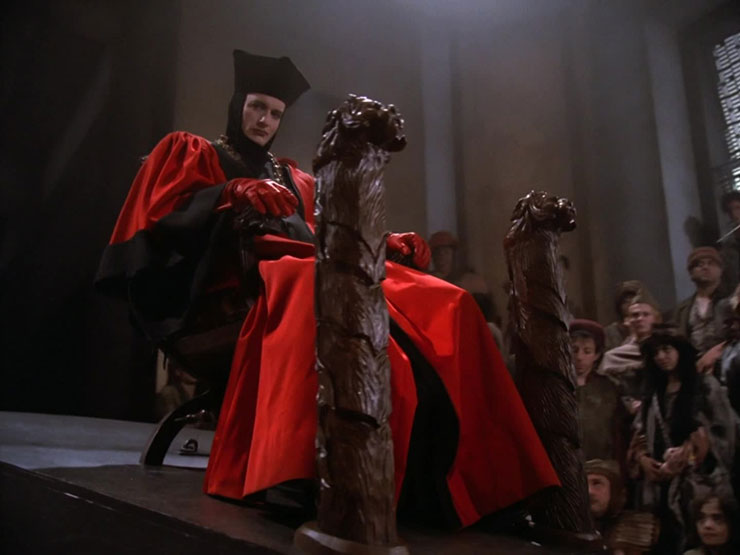 Q sitting on his throne