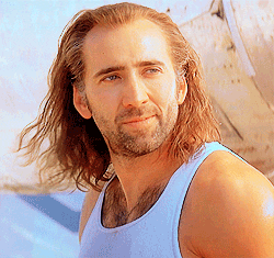 Nic Cage winking with long hair in Con Air