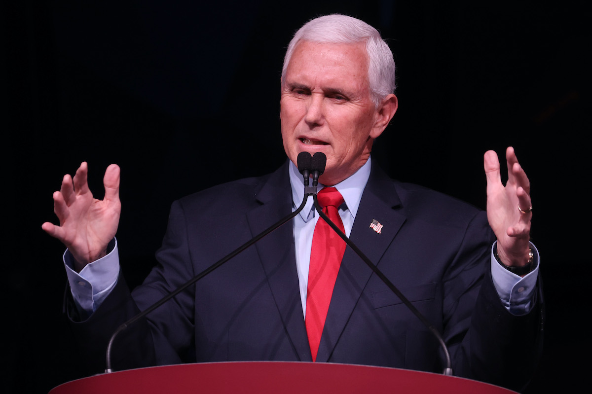 Mike Pence gestures and grimaces during a speech.