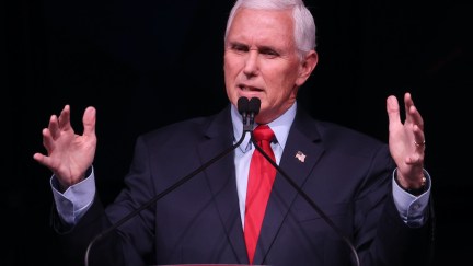 Mike Pence gestures and grimaces during a speech.