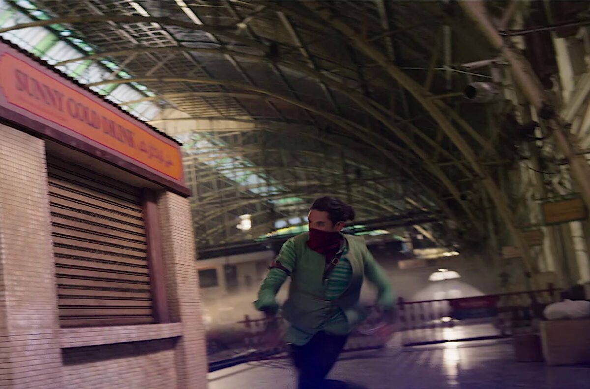 Red Dagger running up the side of a subway kiosk