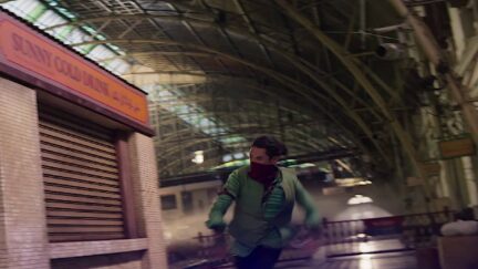 Red Dagger running up the side of a subway kiosk